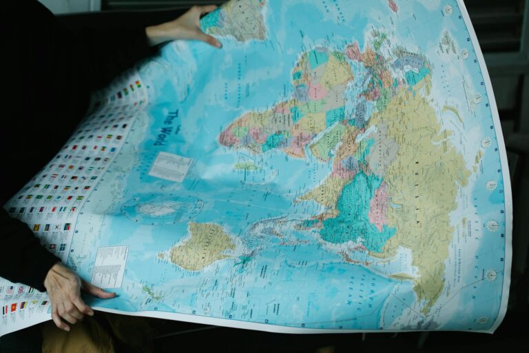 woman holding worlds political map