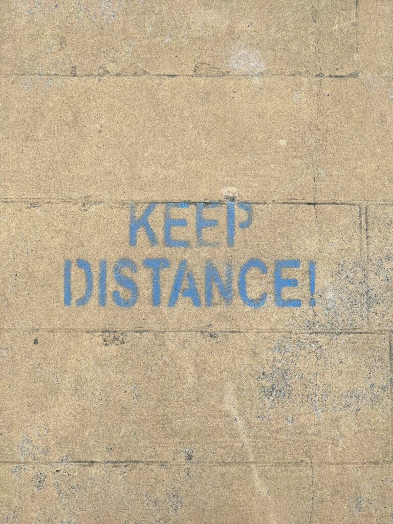 a warning painted on concrete wall